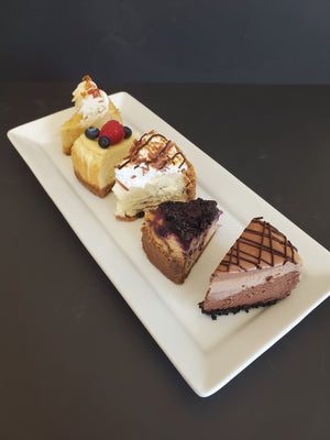 Cheesecake slices. Including Maple Cheesecake, Classic Cheesecake with berry topping, Smores Cheesecake, Wild Blueberry Cheesecake, Triple Fudge Cheesecake.